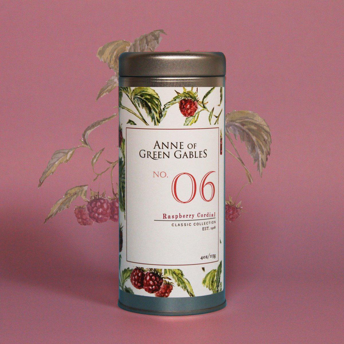 Raspberry Cordial with raspberries in the background